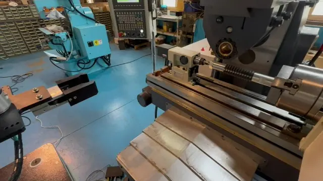 CNC 4th-axis groove milling with robot handling and vision inspection